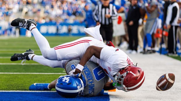 Alabama Crimson Tide defensive back Kool-Aid McKinstry (1) tackles Kentucky Wildcats running back Demie Sumo-Karngbaye (0) during the third quarter at Kroger Field.